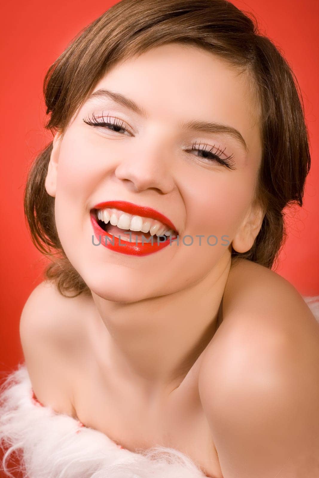 a  christmas girl over the red background