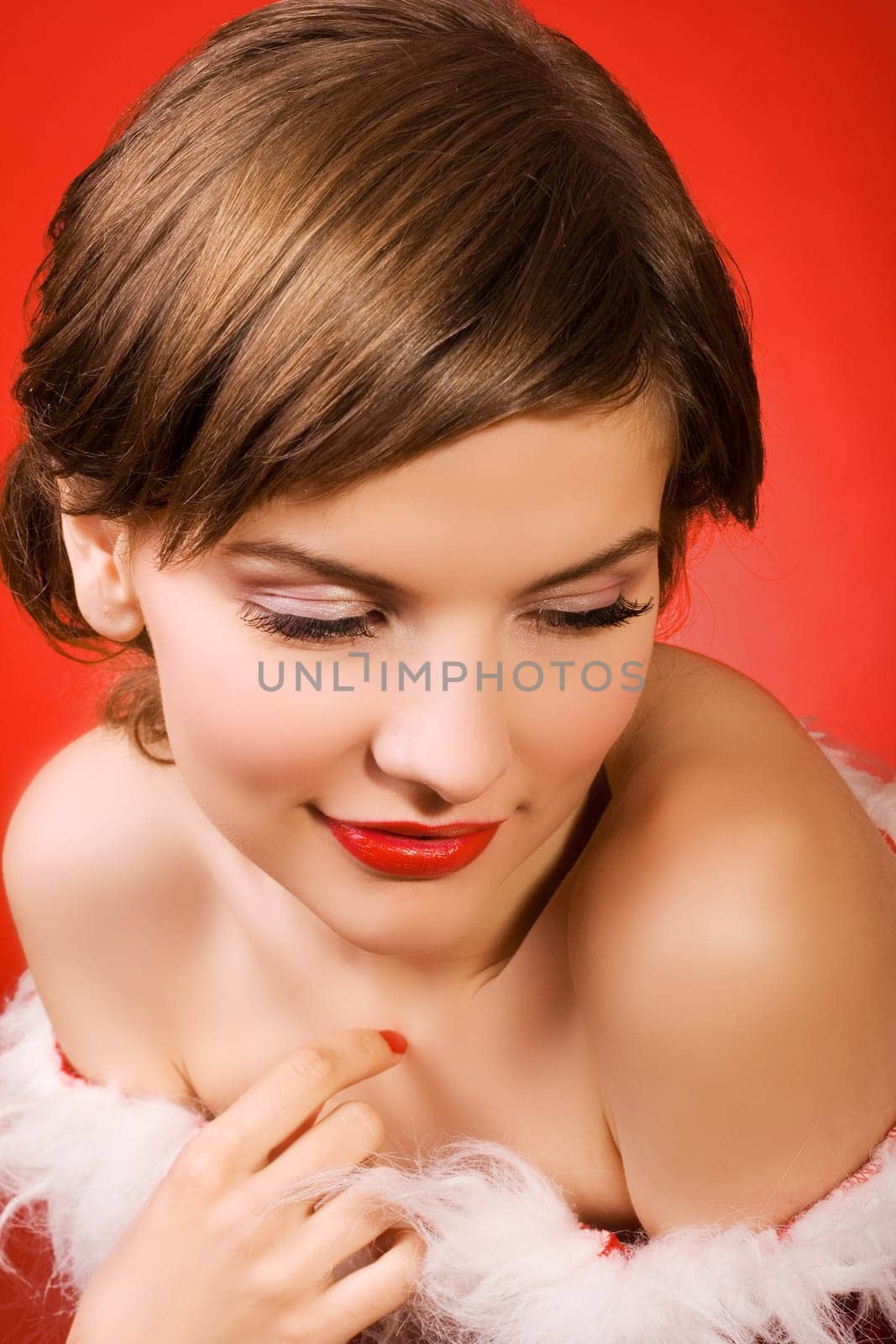a  christmas girl over the red background
