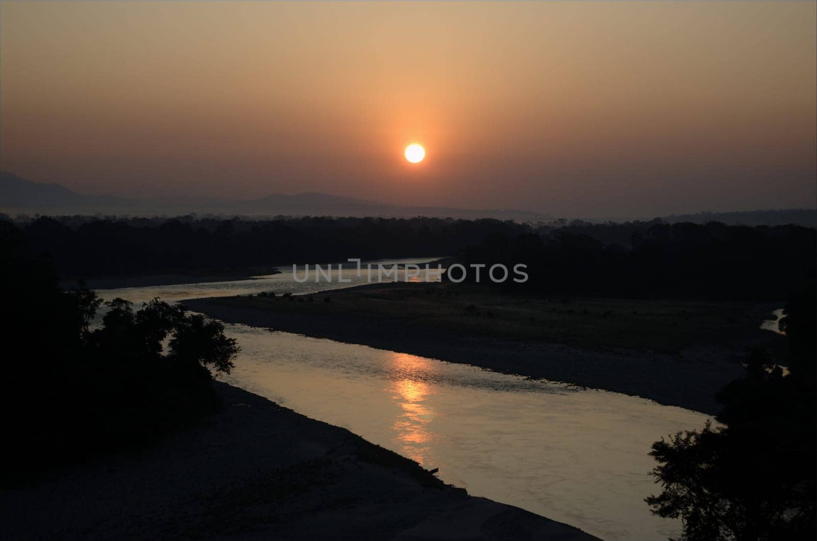 A majestic view of sunrise across the river at Bhalukpong