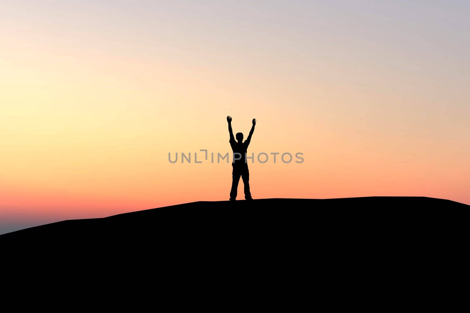 Silhouette of a man with open arms over sunset background - freedom feeling