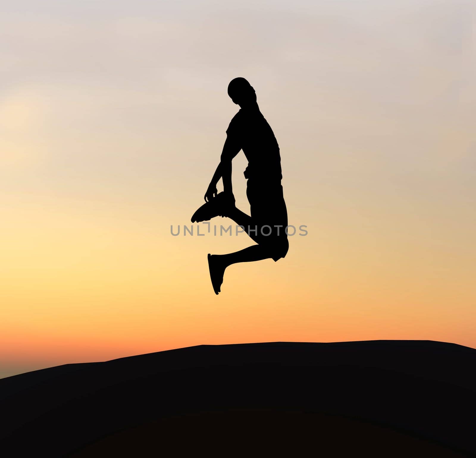 Young boy silhouette jumping of joy - sunset background