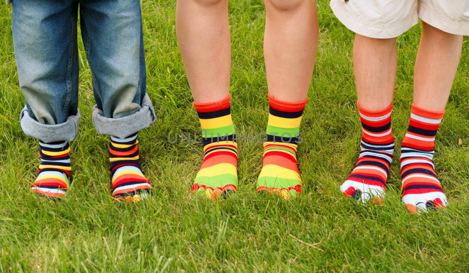 Three kids Wearing Multi colored Toe Socks