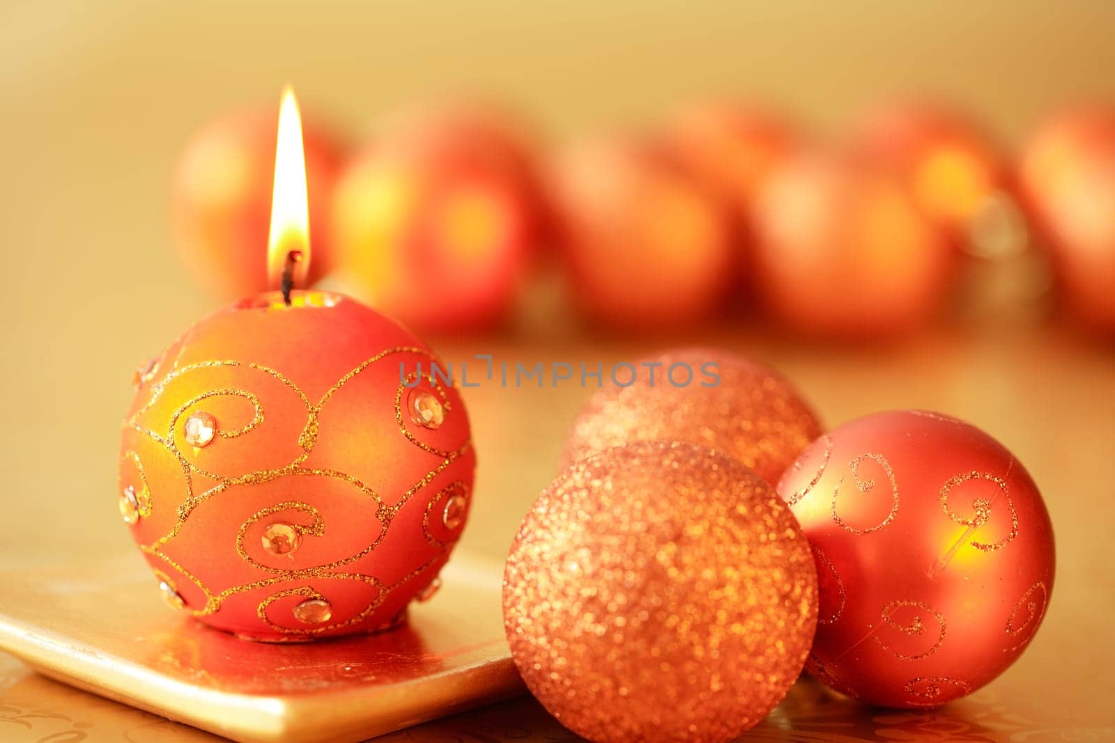 Beautiful Christmas candles in golden tone