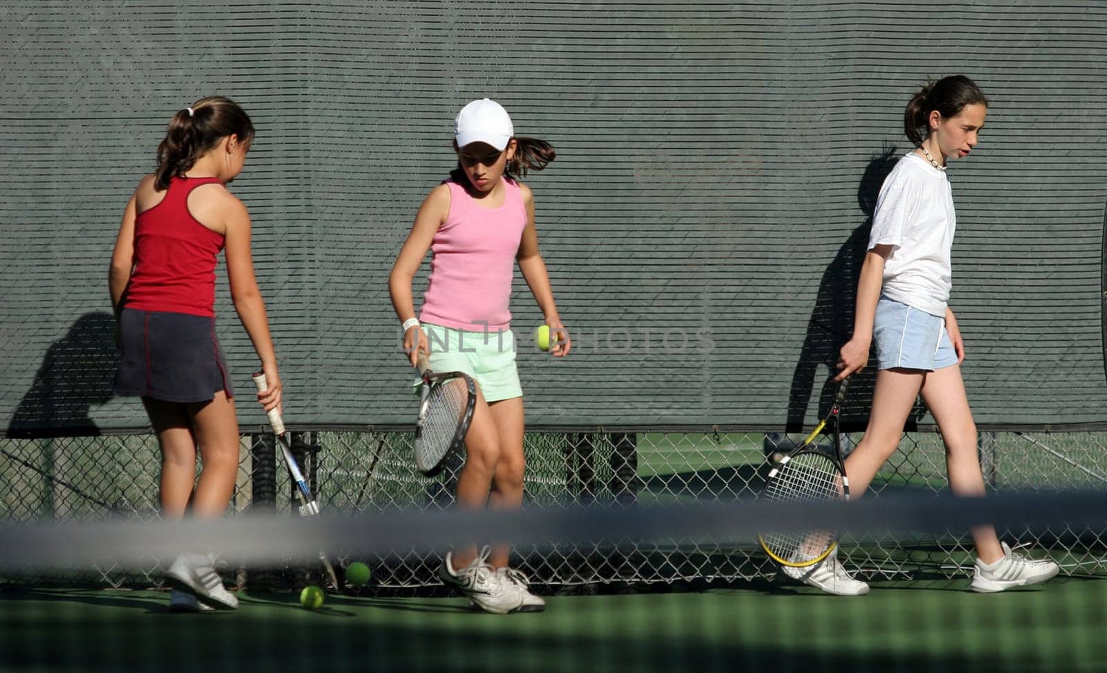 3 girls at tennis practice