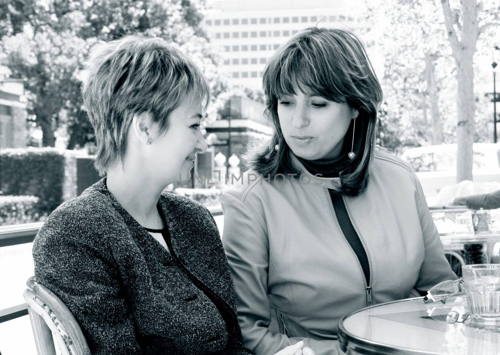 Girlfriends having lunch in a street cafe