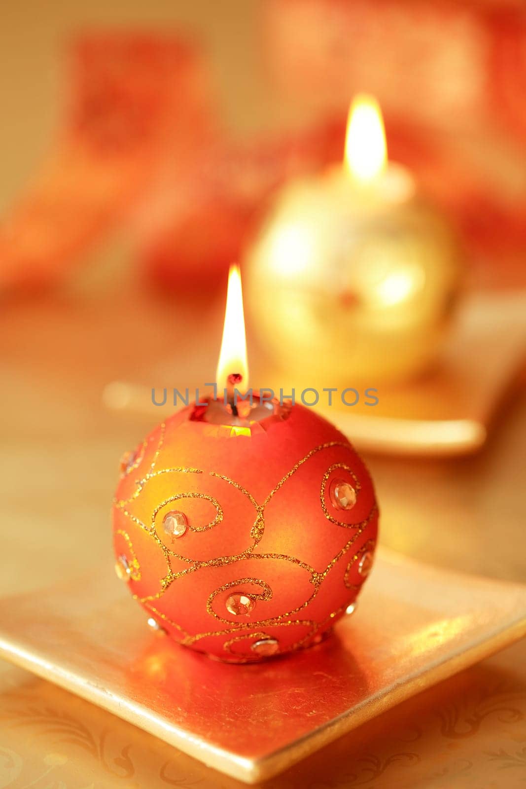 Beautiful Christmas candles in golden tone