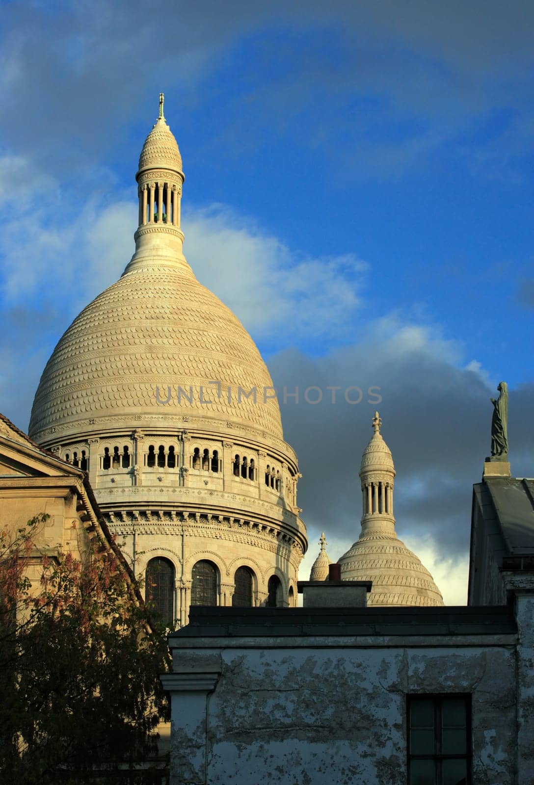 Sacre Coeur in Paris, France, as the sun begins to lower.