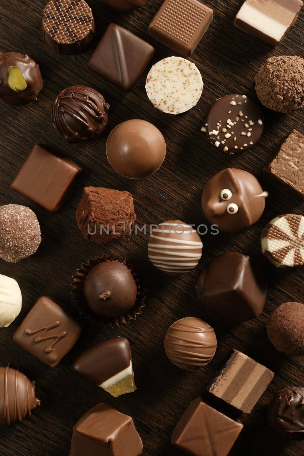 Delicious background of dark, milk, and white chocolate pralines.