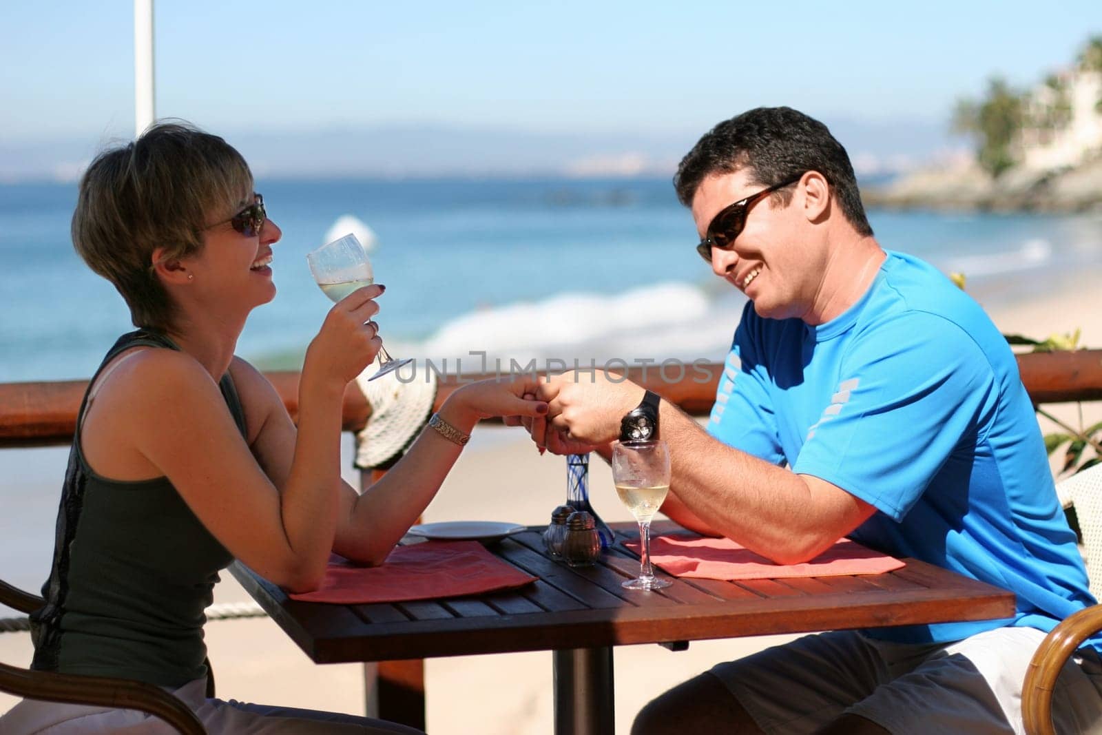 Happy couple at a seaside cafe