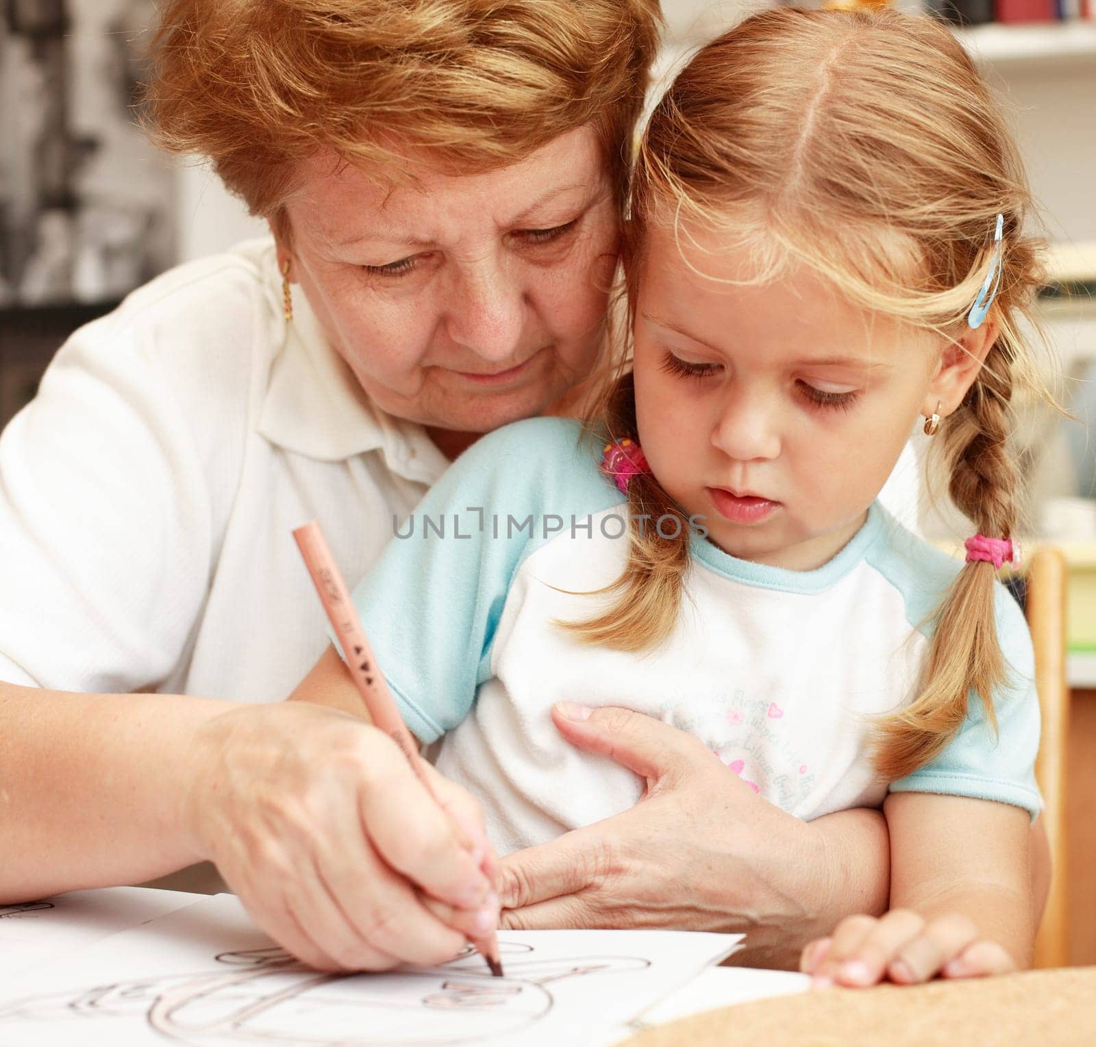 Grandma and grand-daughter painting