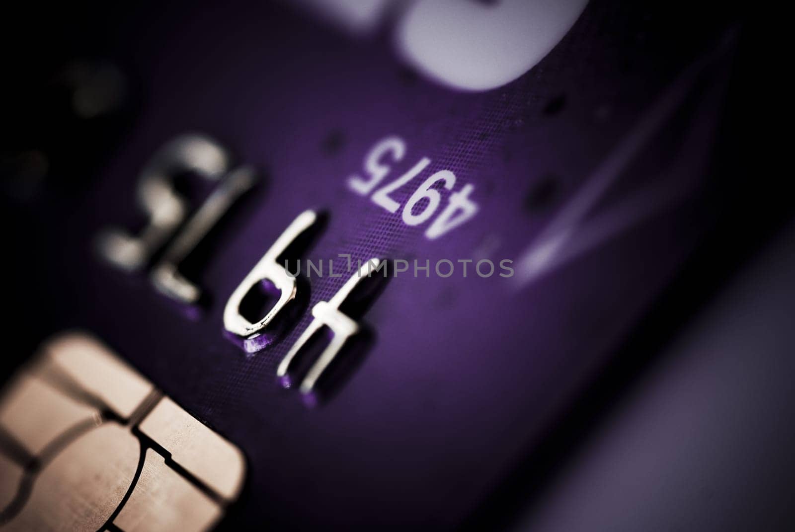 Credit card on dark background purple tone