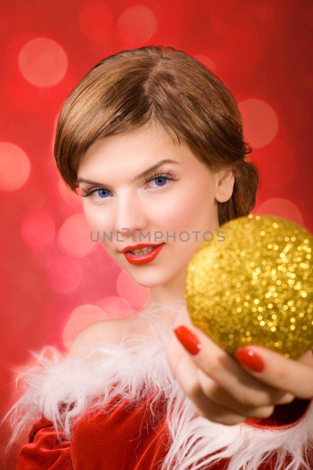 a christmas girl dressed in the red fur coat