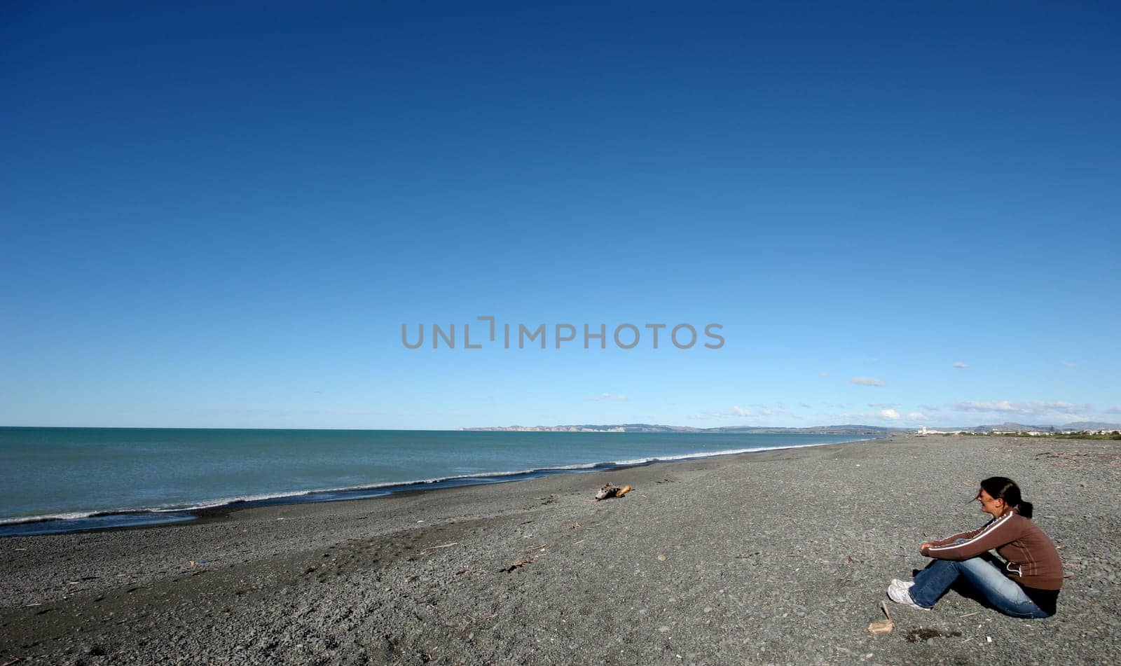 Woman staring out to sea