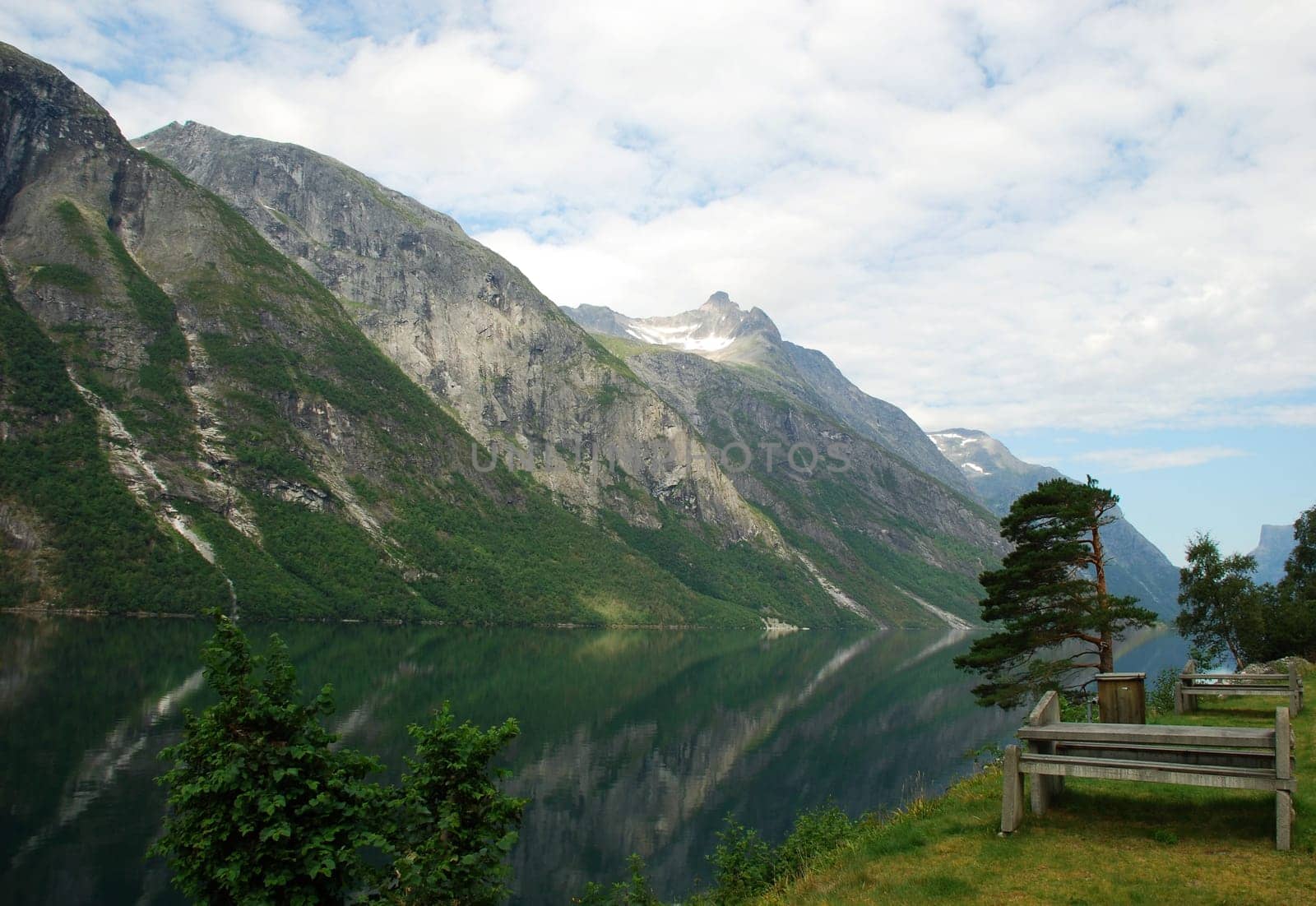 Road to Eikesdal, near to Mardalsfossen. The long Eikesdalsvatnet lake lies just 26 metres above sea level, while the surrounding mountains tower to heights of 1,500 to 1,800 metres straight up from the lake. The Mardalsfossen waterfall cascades 297 metre