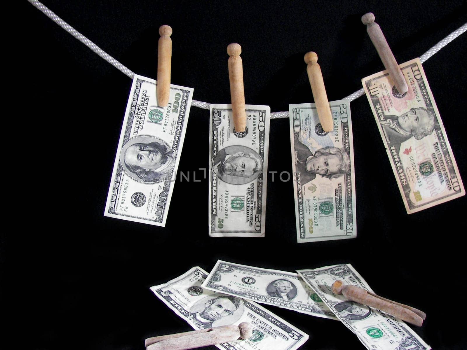 American currency handing on a clothesline.
