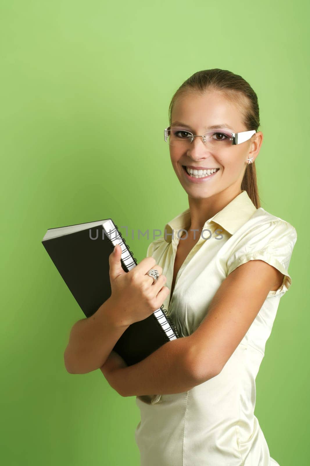 business portrait of a young and successful woman writing at a schedule