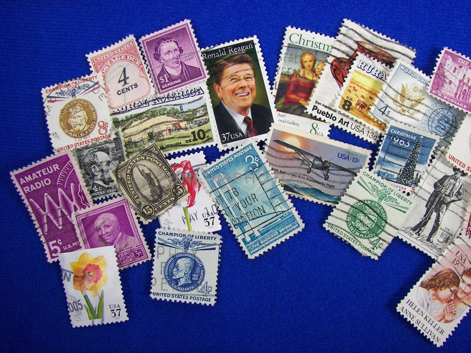 USA stamp collection on blue background.