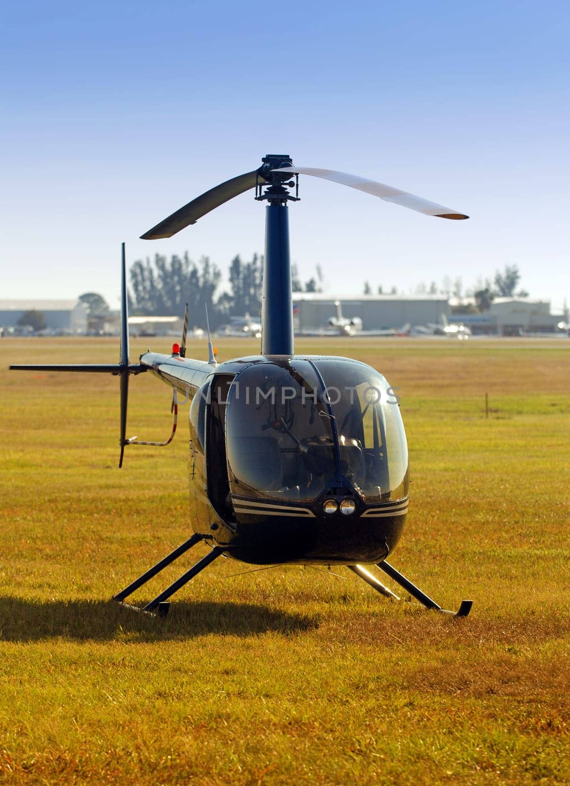 Front view of small helicopter on the ground
