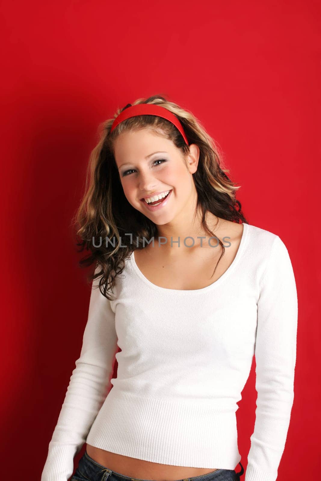 A young, attractive and happy woman is smiling