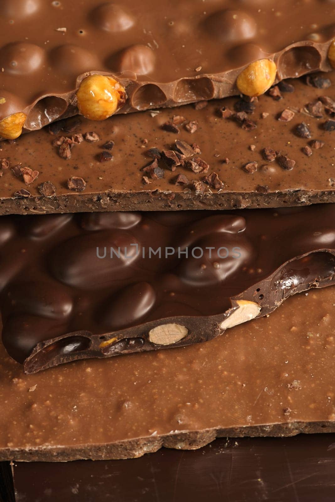 Slabs of assorted delightful chocolate goodness stacked on top of each other. Sweet!