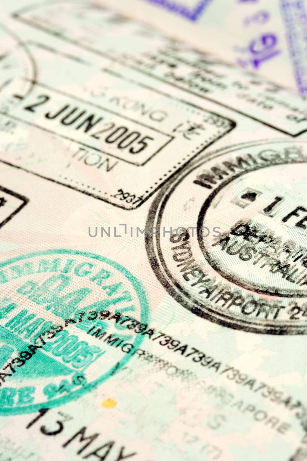 Macro / selective focus image of passport stamps.  Focus is in the middle.