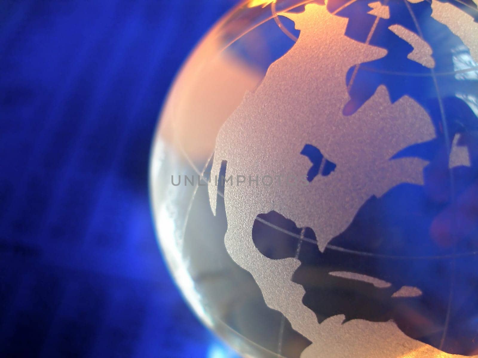 macro of a glass globe in front of business figures, with focus on north and central america