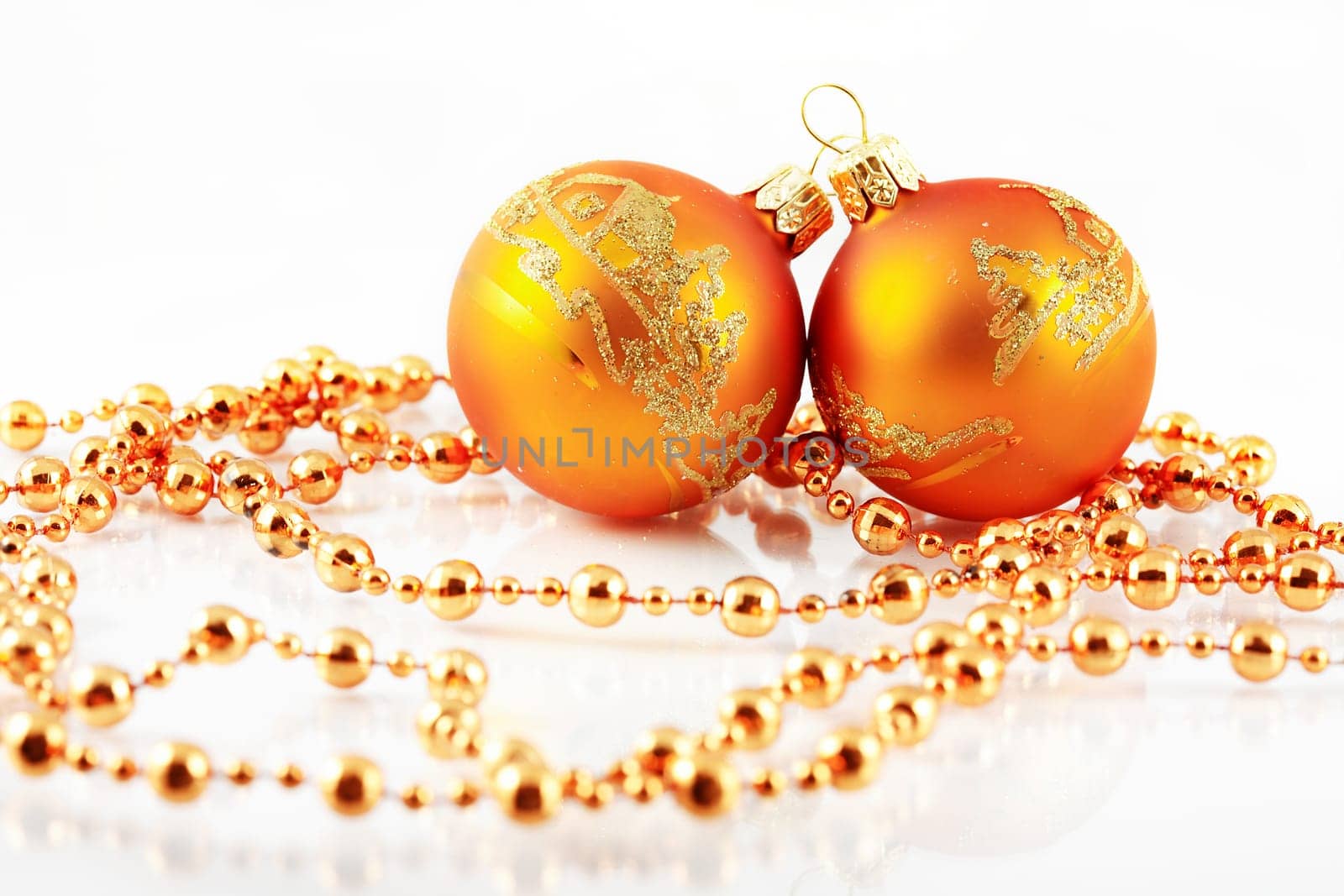 Christmas balls and ribbon on white background