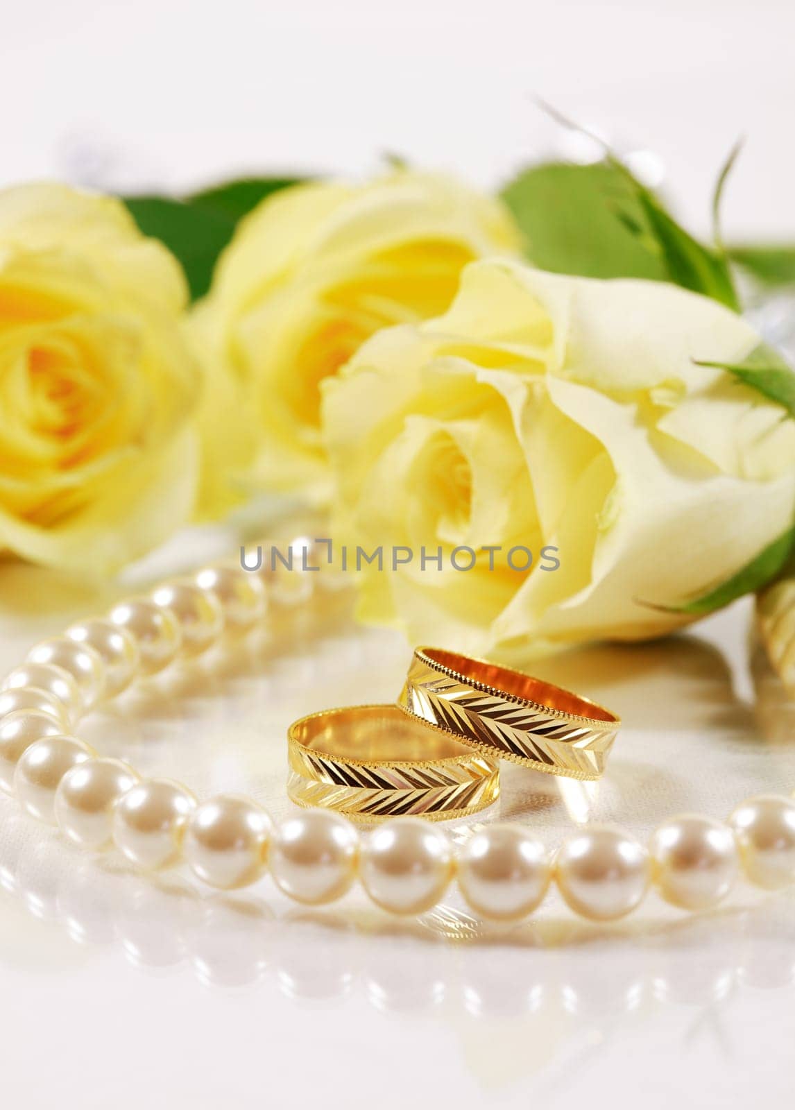 Wedding still life with beautiful golden rings