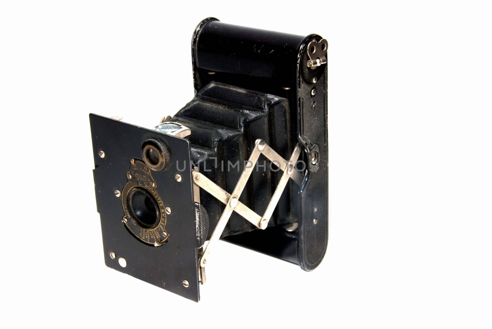 Antique collapsible camera isolated on white.