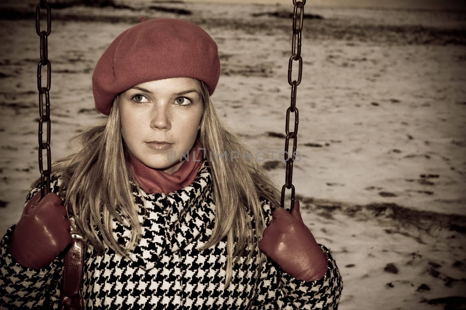 A depressive picture of a young girl, who is alone on swing