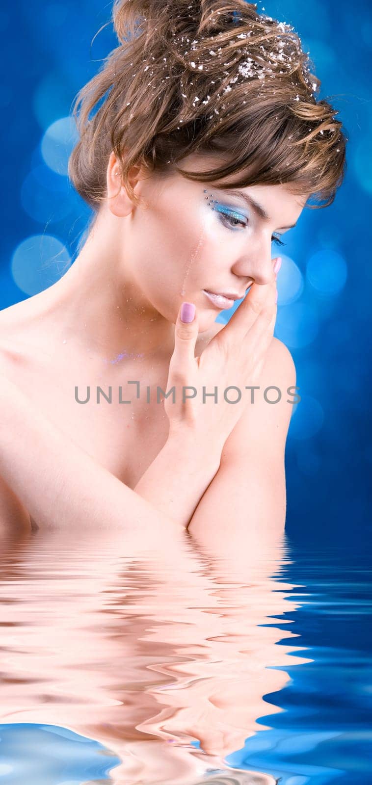 snow girl standing in the icy water
