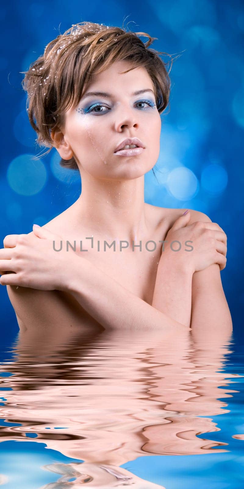 snow girl standing in the icy water