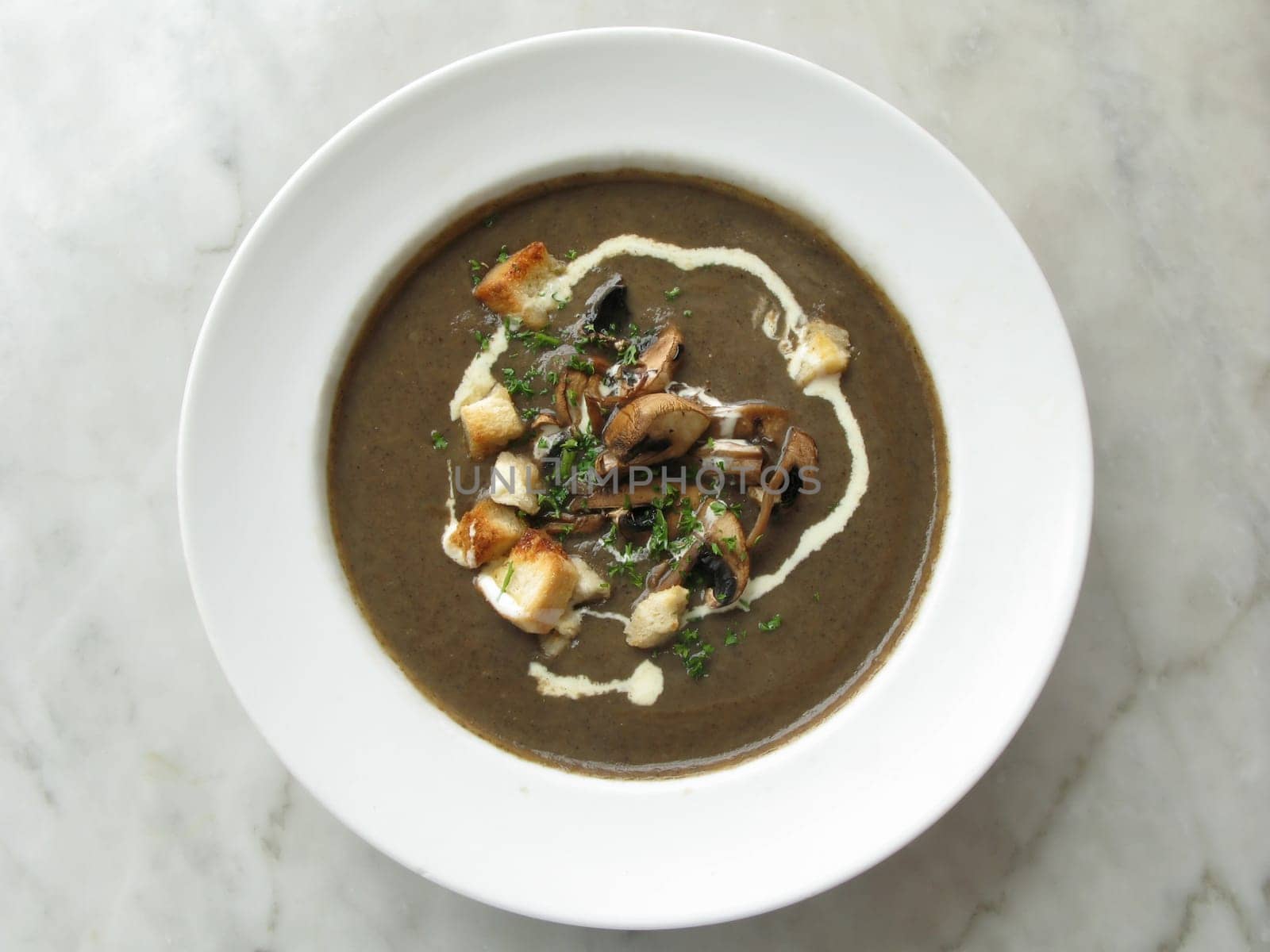top shot photo of mushroom soup on marble table