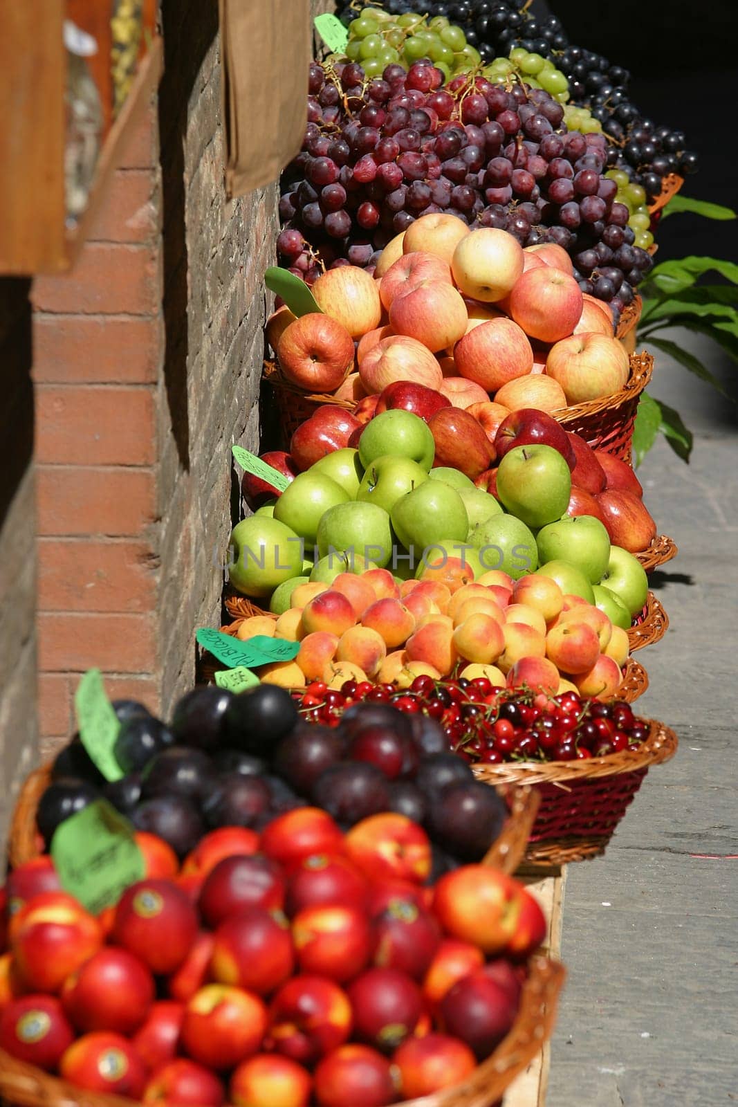 Fruit for sale at a market on the streets of Siena, Tuscany, Italy
