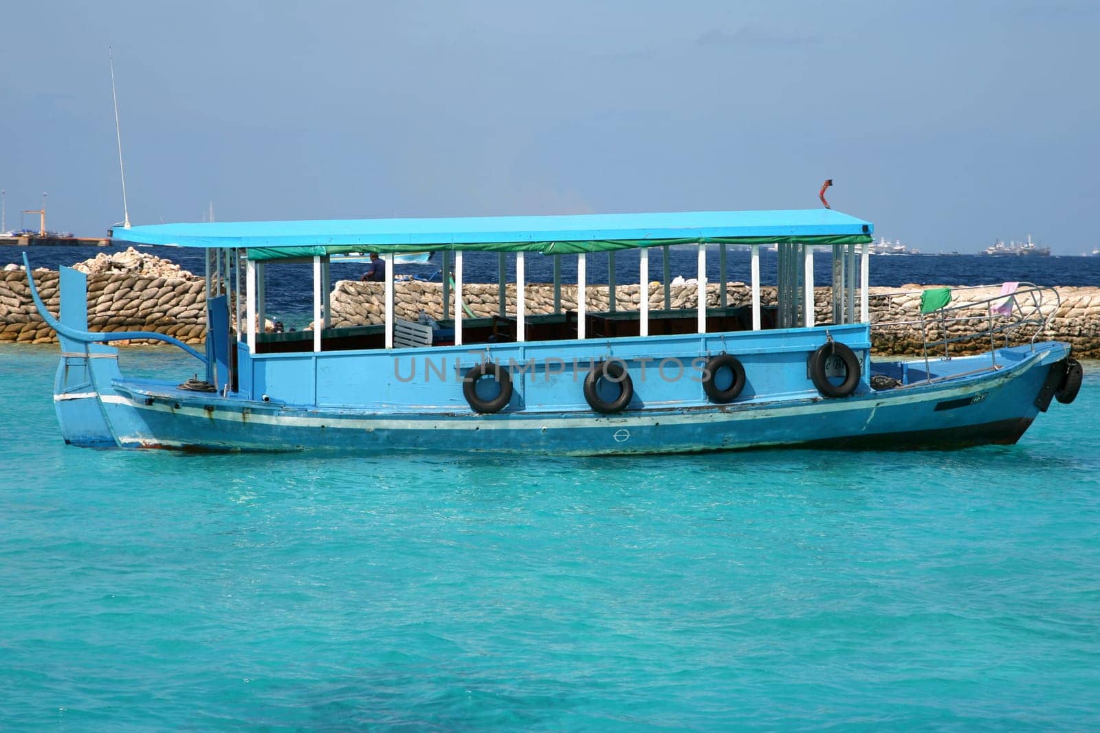 Ship in the Maldives cruising between the reef