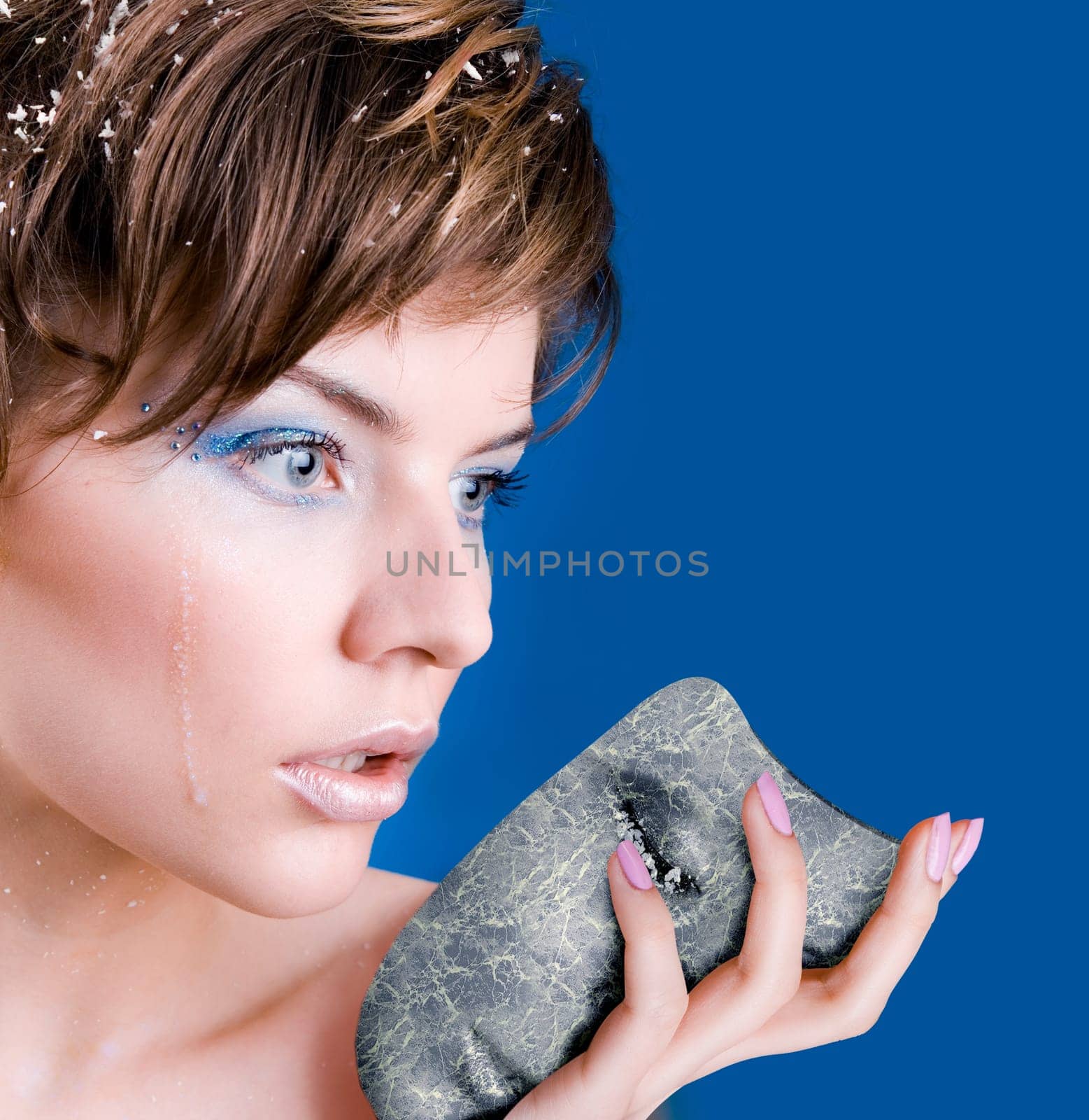 crying snow girl with a frozen tear on her cheek