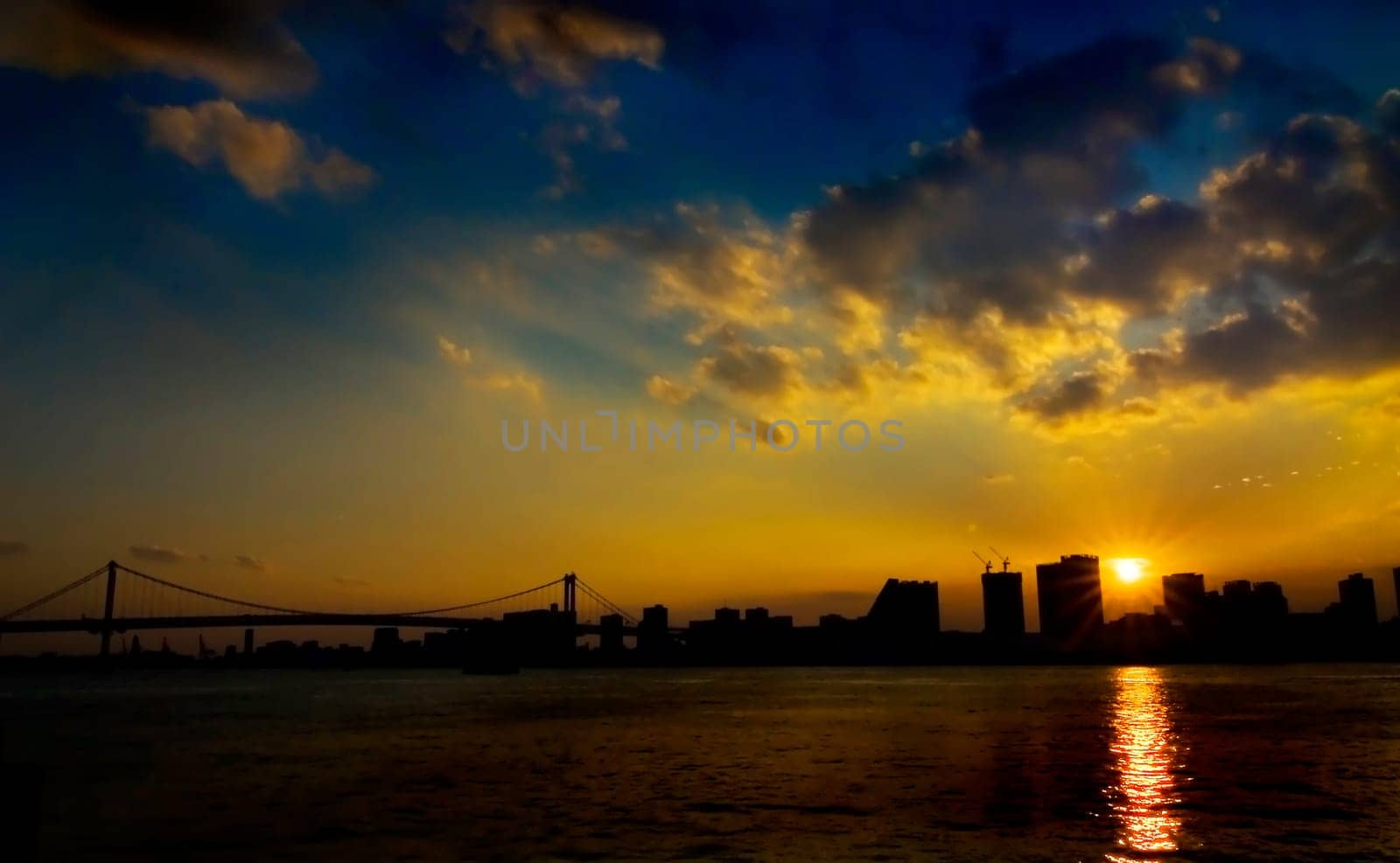 Sunset across Tokyo bay and the rainbow bridge
