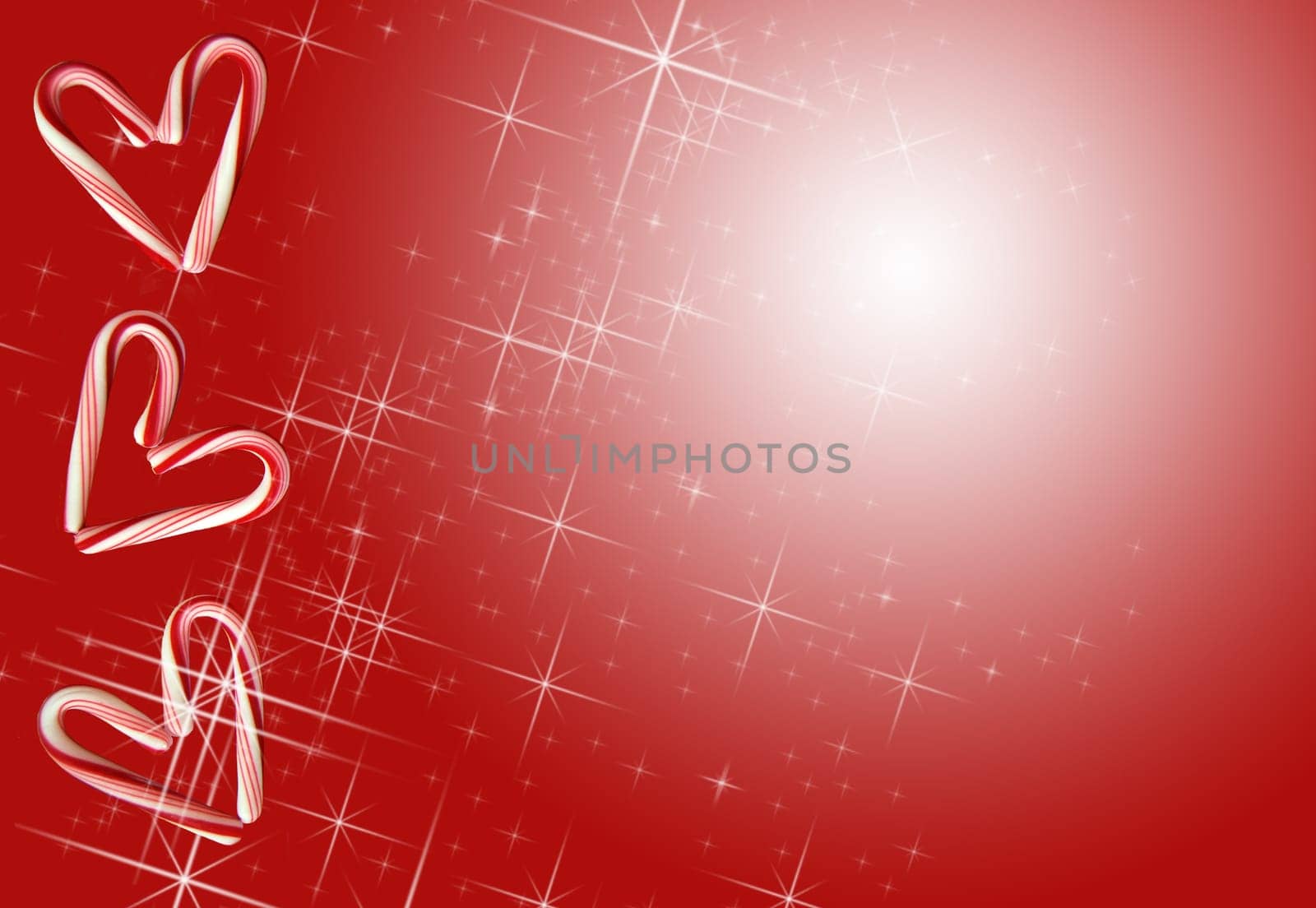 Candy canes shaped as hearts on sparkling background.