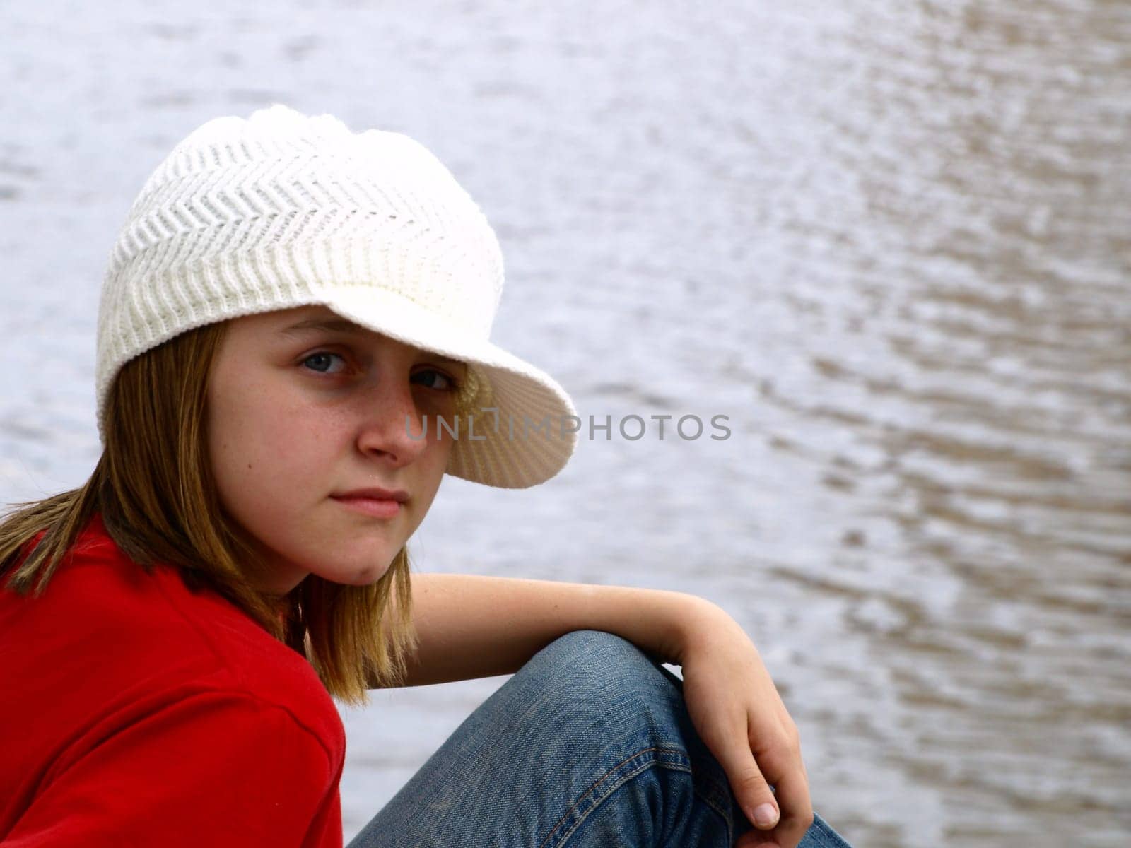Young adolescent girl in crochet hat
