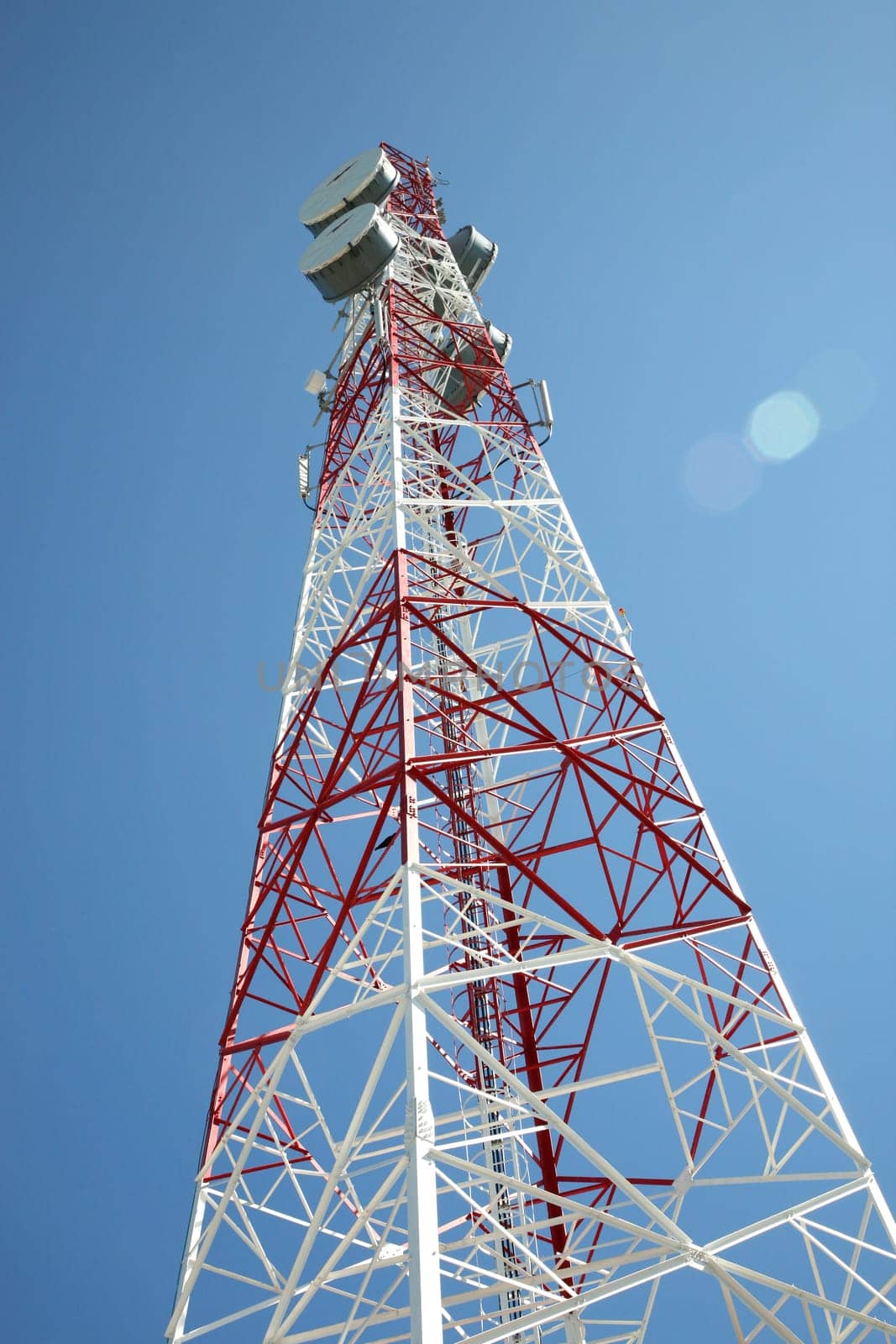 communications tower with a blue sky behind