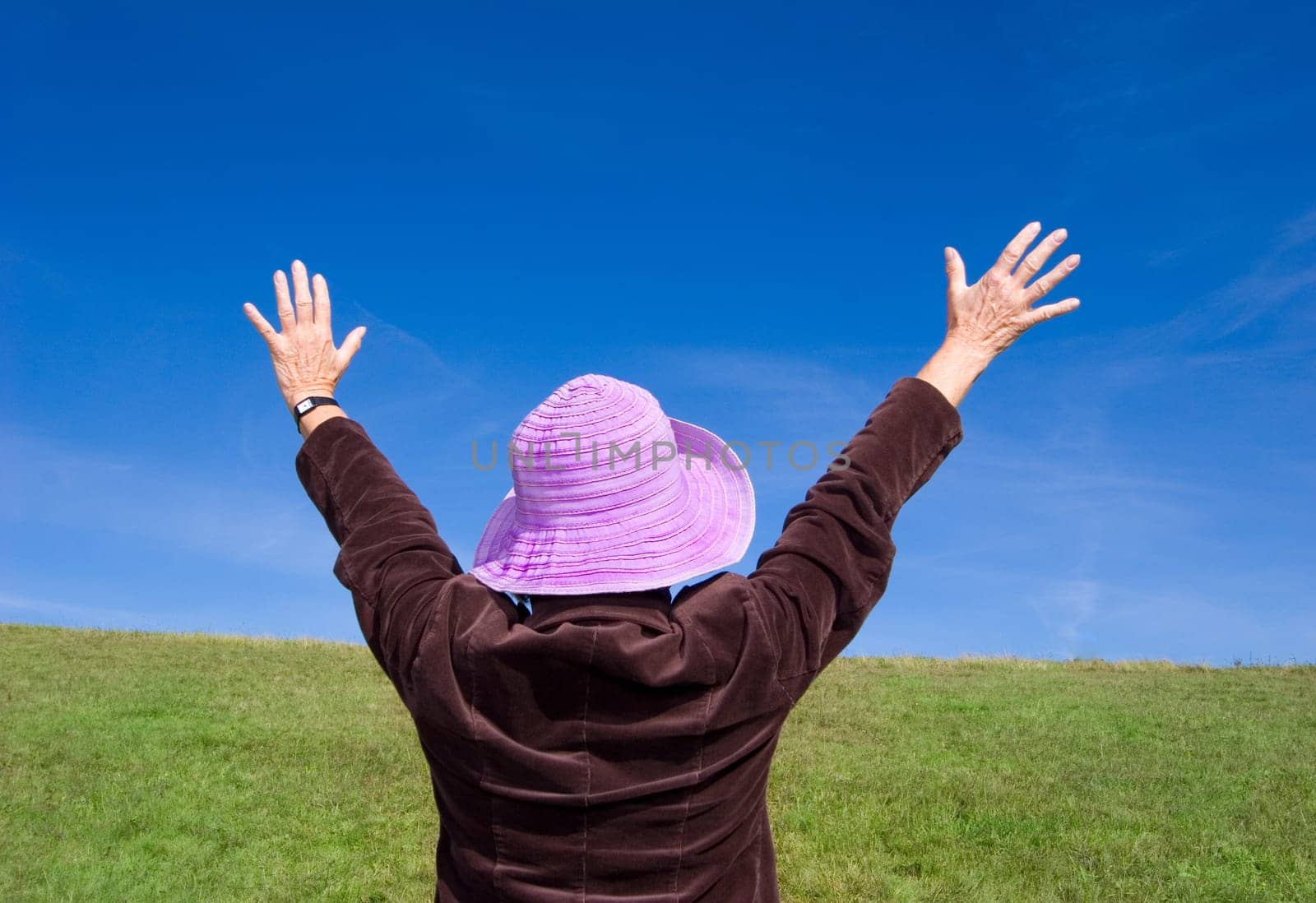 Attractive mature woman enjoying life on the meadow :-)