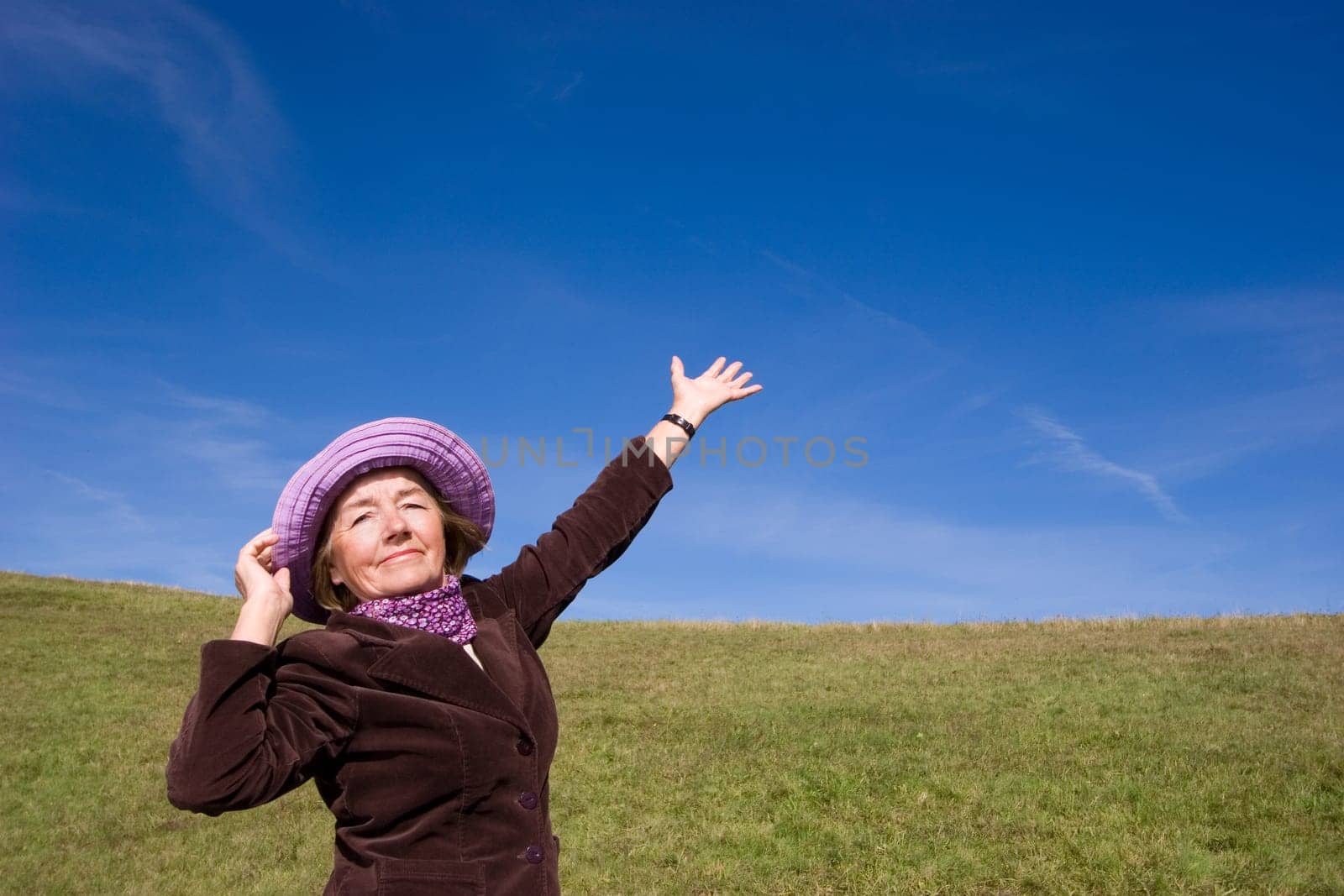 Attractive mature woman enjoying life on the meadow :-)