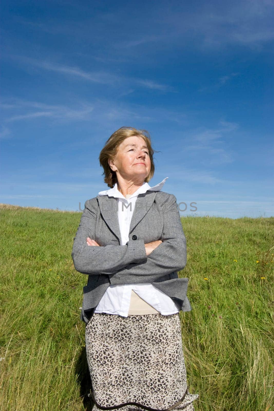 Attractive mature woman enjoying life on the meadow :-)
