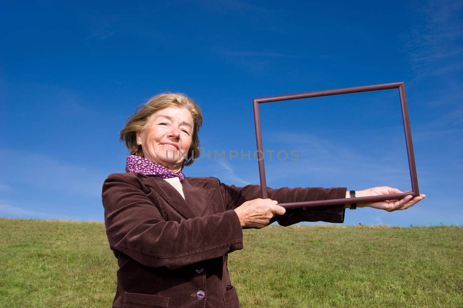 Attractive mature woman enjoying life on the meadow :-)