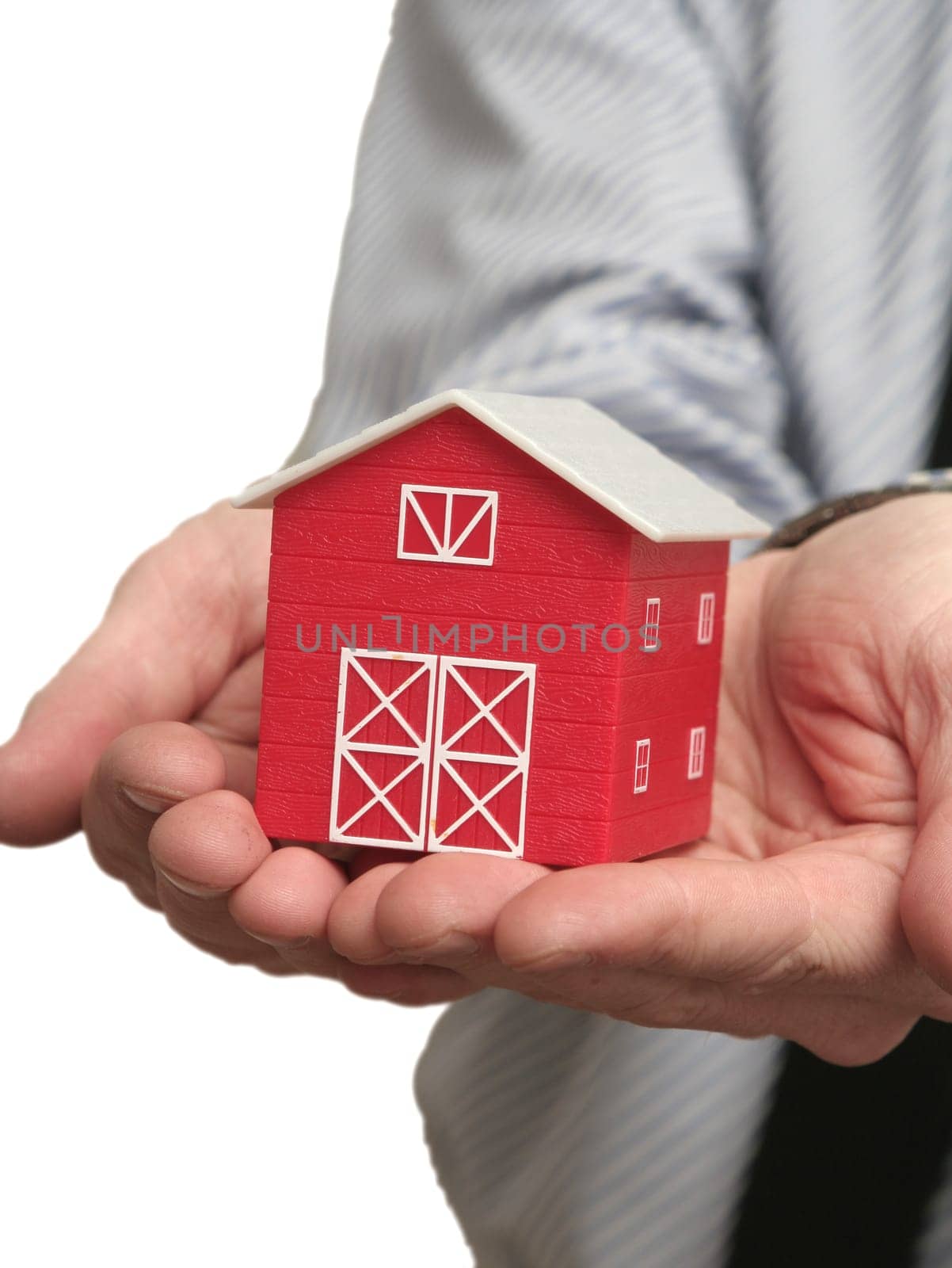 The man holds the red house in a hand