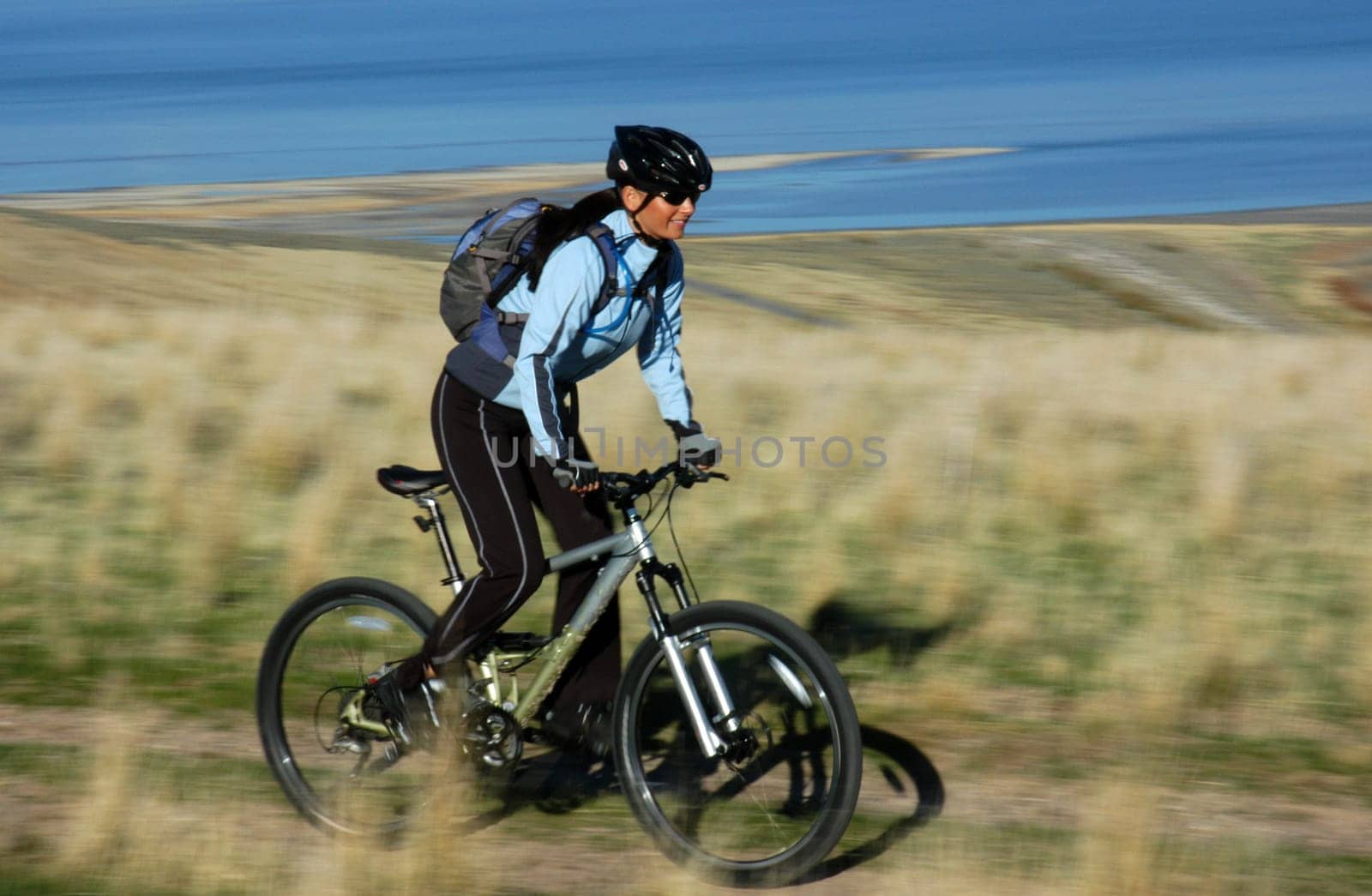 Blur/action shot of female mountain biker