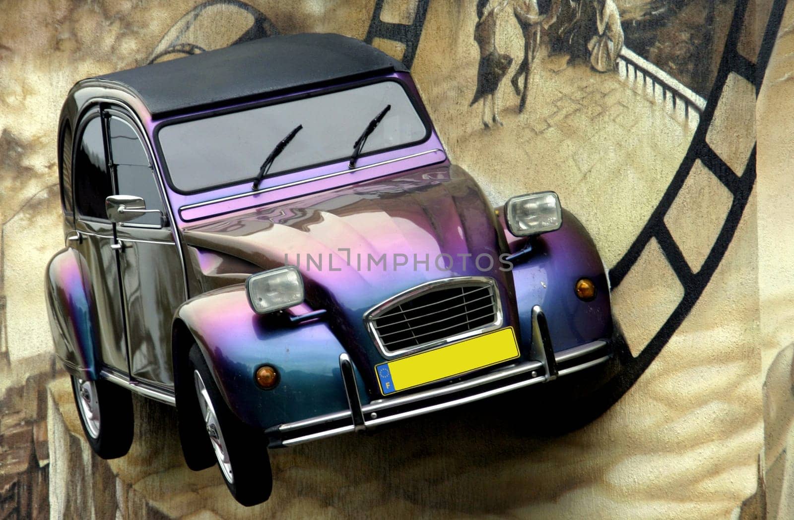 photo of a legendary car hanging from a wall of a french restaurant in Koszalin, Poland
