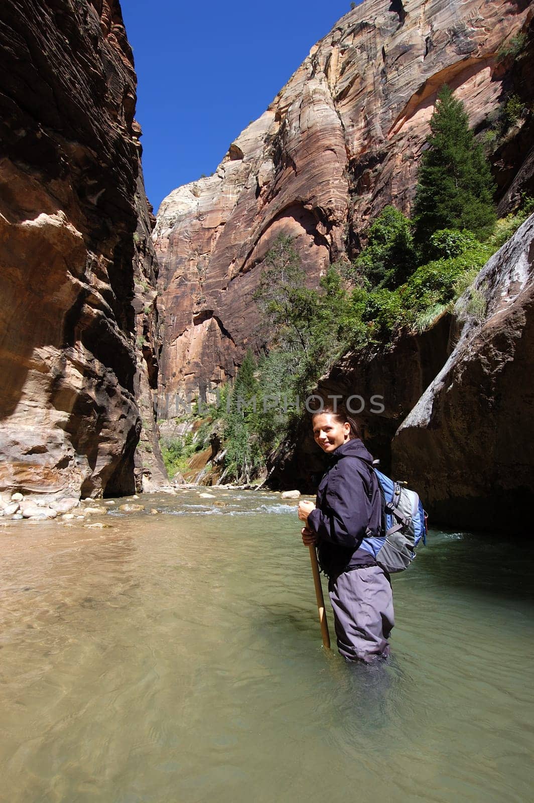 Woman hiking the Narrows in Zion National Park