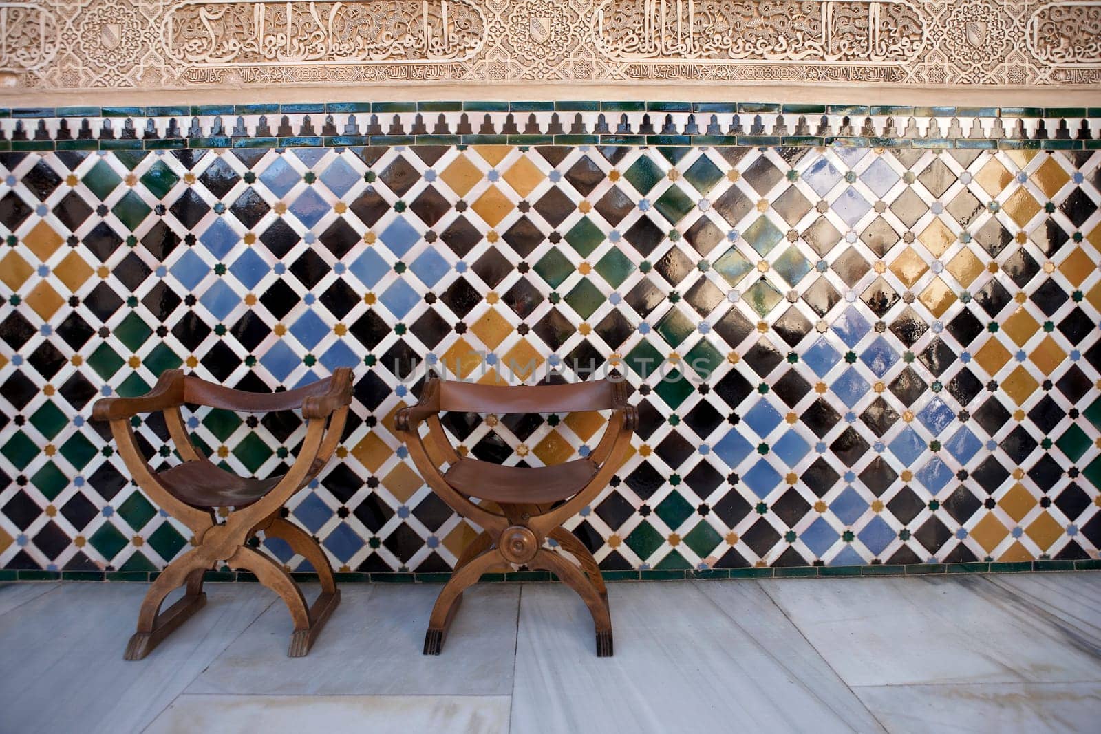 empty chairs in the patio de comares palacios nazaries alhambra palace granada spain andalucia taken in august 2006