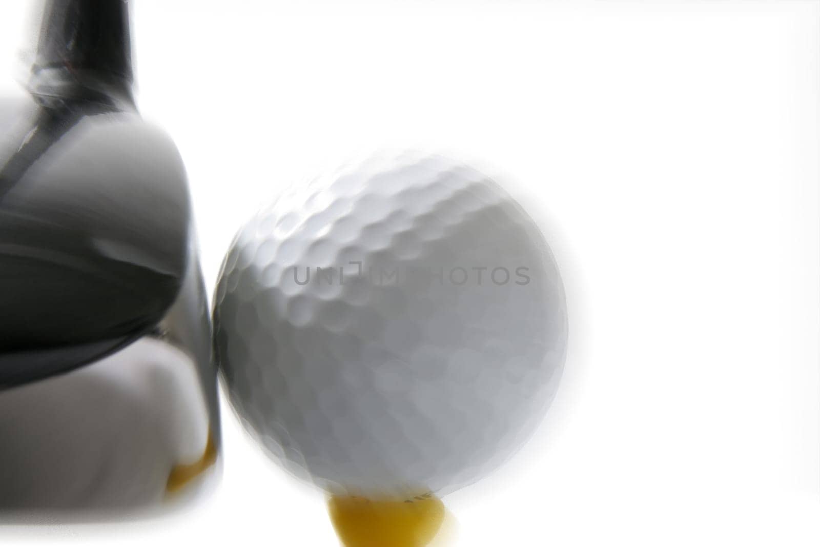 Golf club hitting golf ball